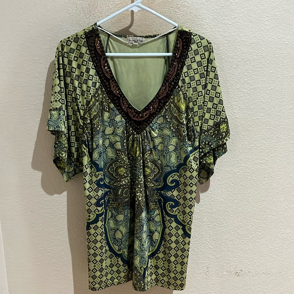 Beautiful multi patterned blouse.